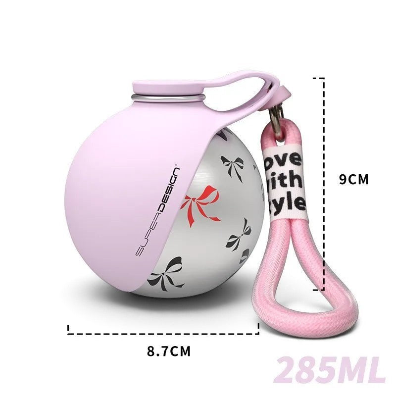 Gourde AventureCanine en acier inoxydable rose et blanc avec motifs de nœuds et dragonne pratique pour chien